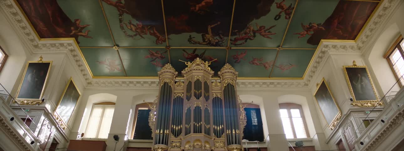 An interior of an establishment with decoration on the ceiling and walls