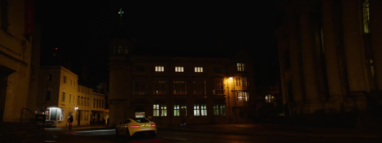 Vehicles driving on the streets of an european city at night