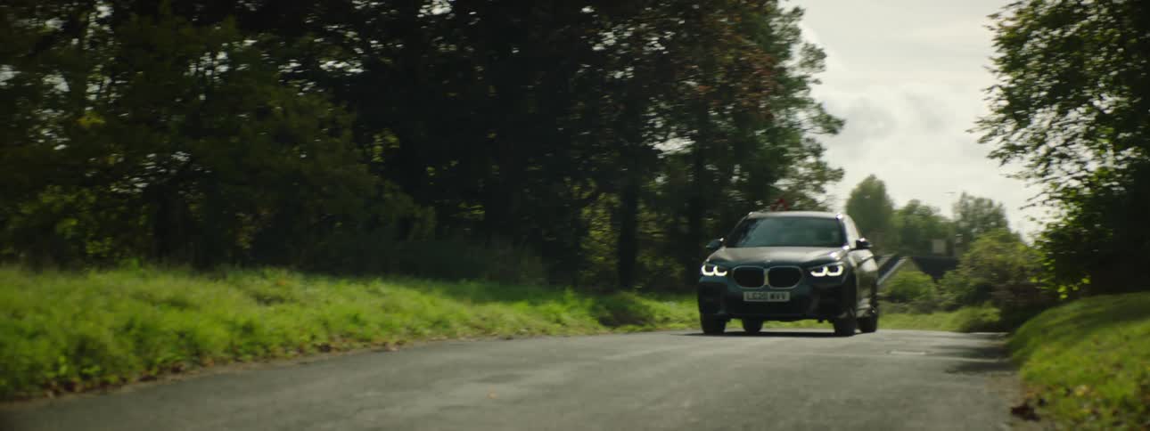 A car drives down the small road