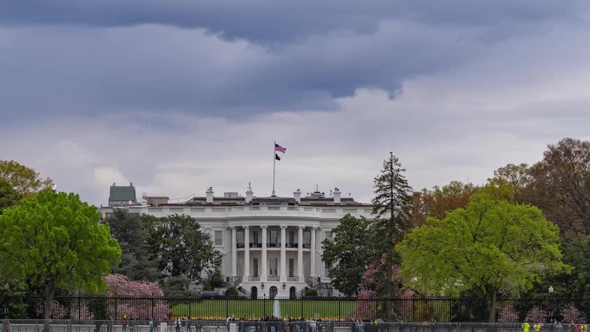 Large crowds of visitors view the white house