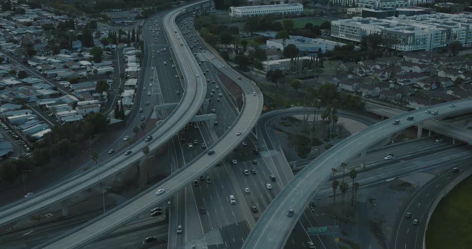 Top view of an urban city with overpasses and highways with vehicle traffic