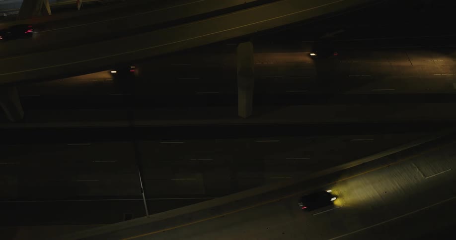 An aerial view of a busy freeway at night