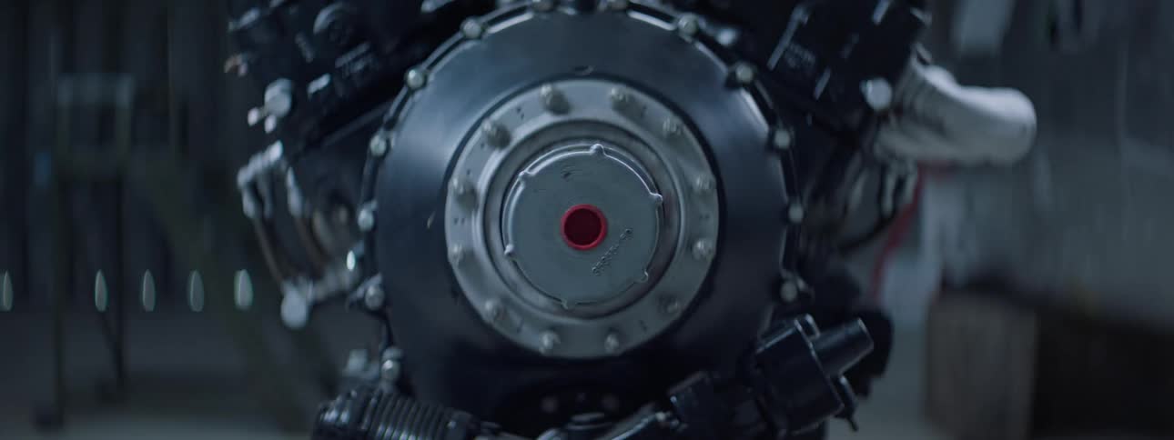 A closeup of a motorcycle engine in a garage