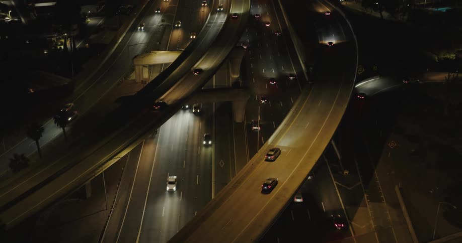 Overpasses and intersections with vehicle traffic at night in an urban city