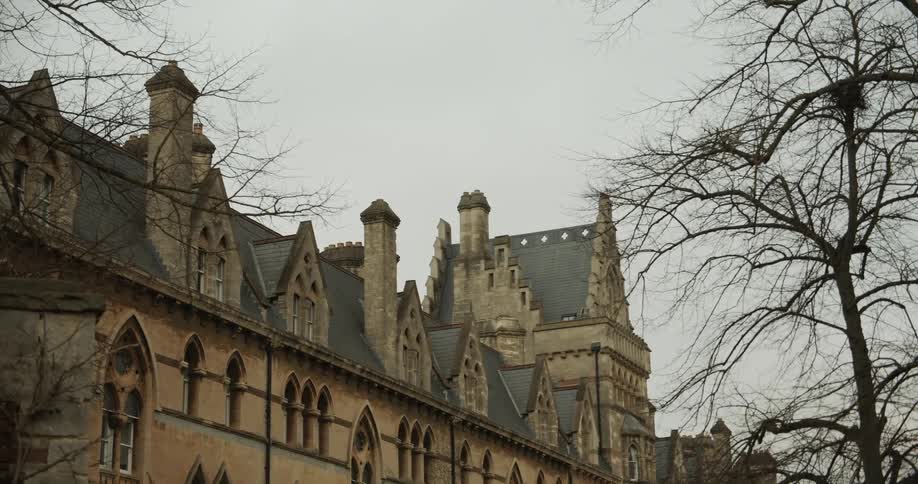 Ancient building with archaic exterior architecture in winter on a cloudy day
