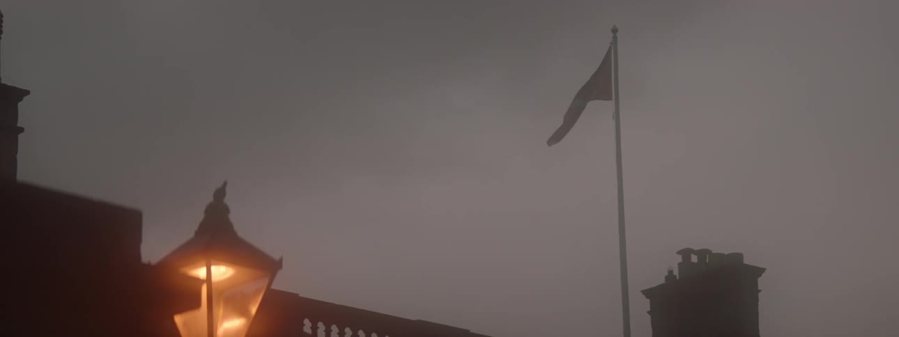 A flag over a building blows in the wind
