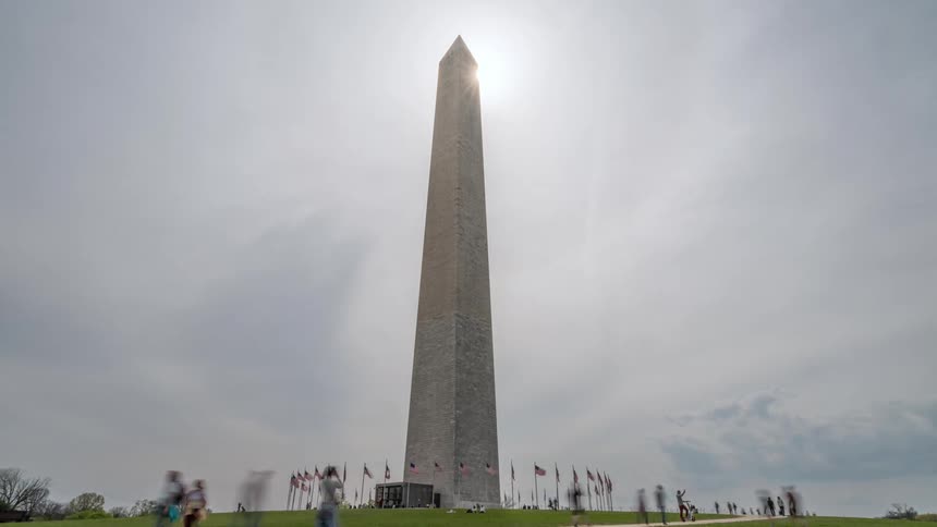 Washington monument square with pedestrians and tourists walking