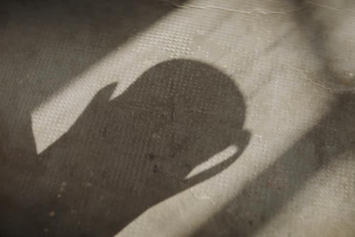 The shadow of a pot shows steam rising