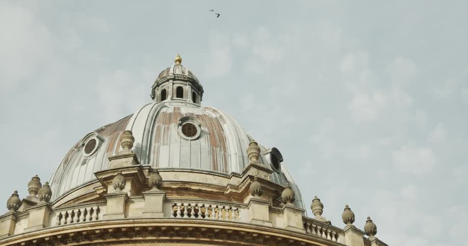 Cultural center of a classical building with a cupola and dome on a cloudy day