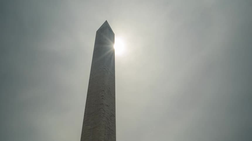 The sun shines on an obelisk
