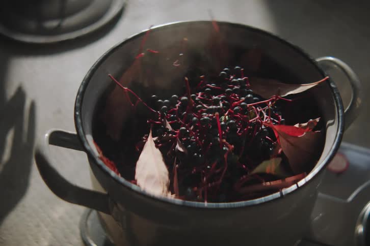 Woman hand covering the pan with spices for cooking