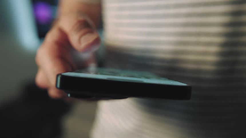 A person scrolling through an iphone