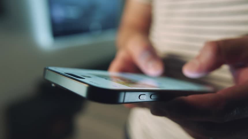 A clip of a person texting with a smartphone