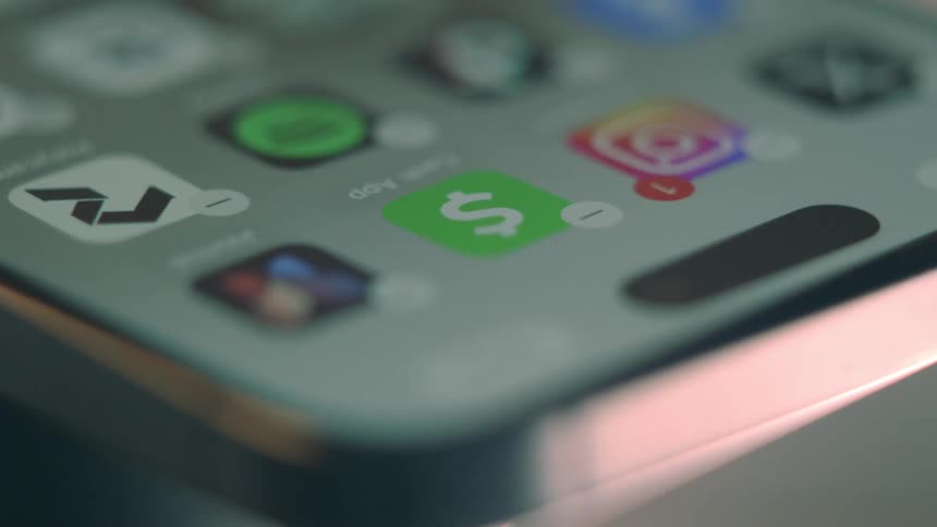 A person swipes on their cell phone