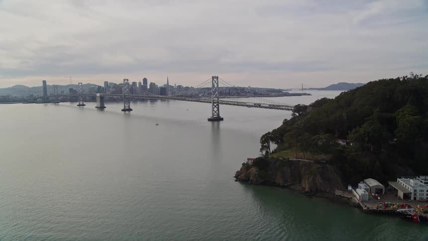A bridge connects a city with land