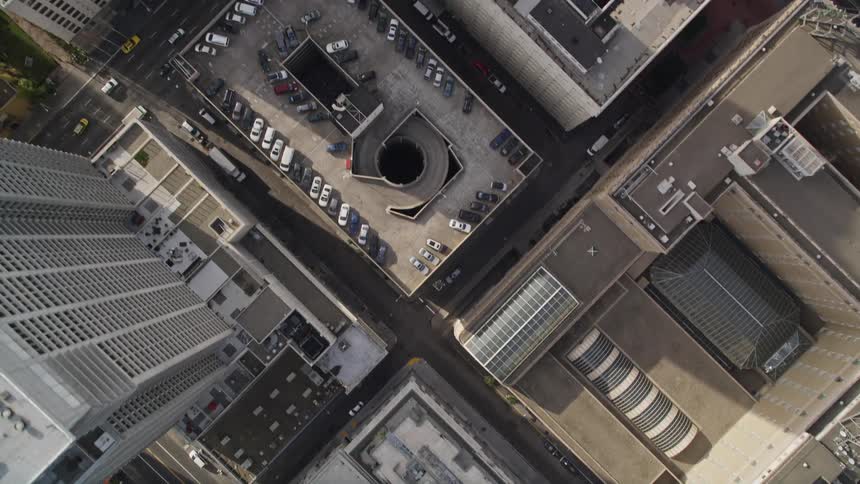 Traffic moves through a dense downtown area
