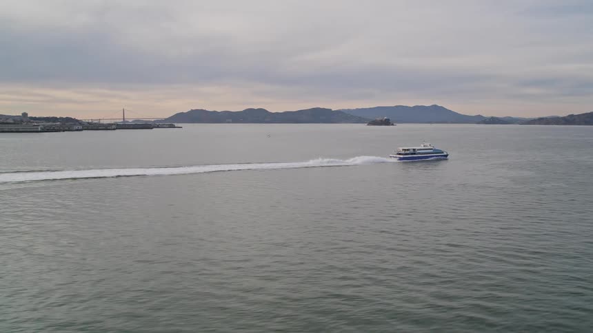 A boat travels away from the city