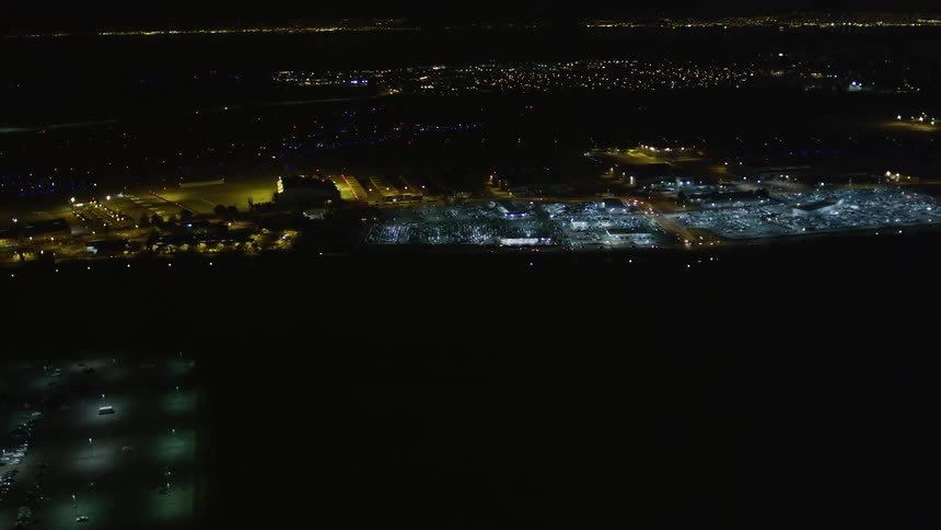 Aerial panorama of an illuminated urban city at night