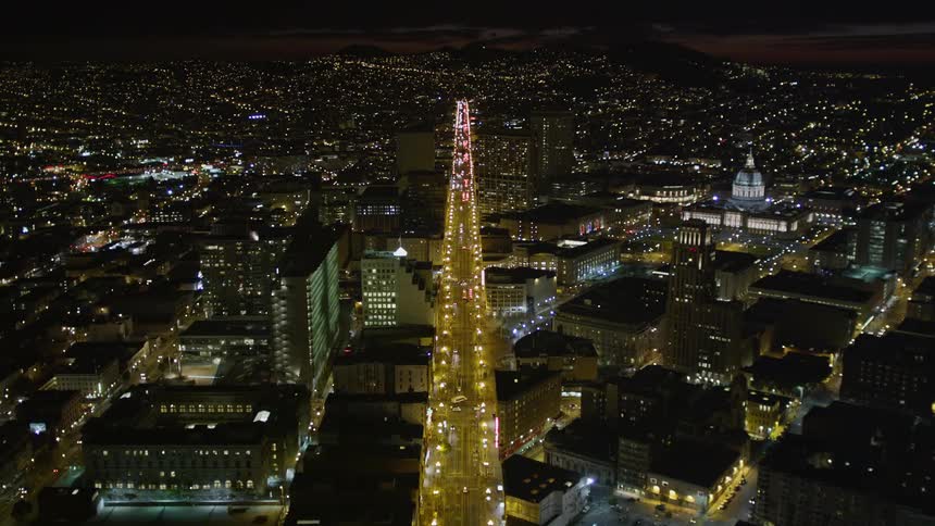 Panorama of a long highway in a metropolis and illuminated with heavy vehicle traffic at night