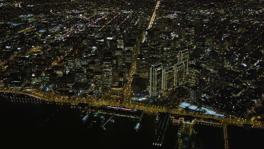 A coastal city lit up at night