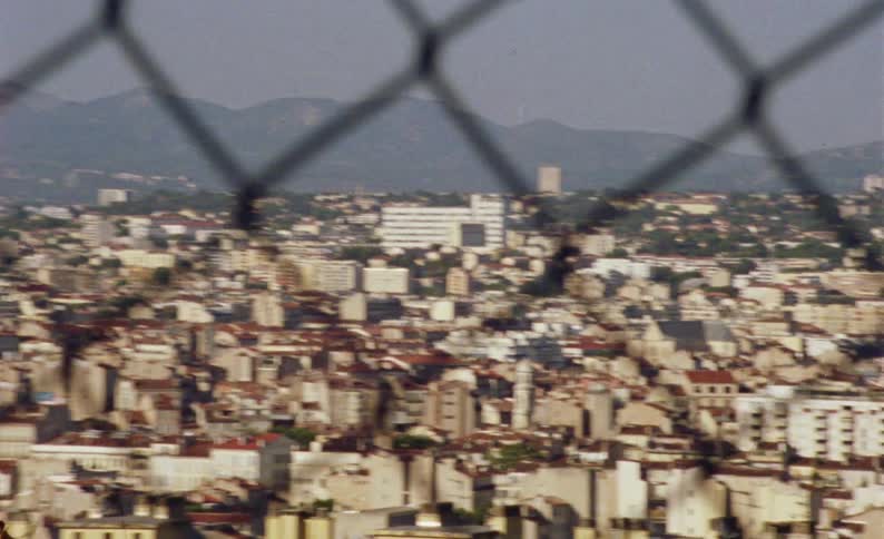 Through the fence is a city