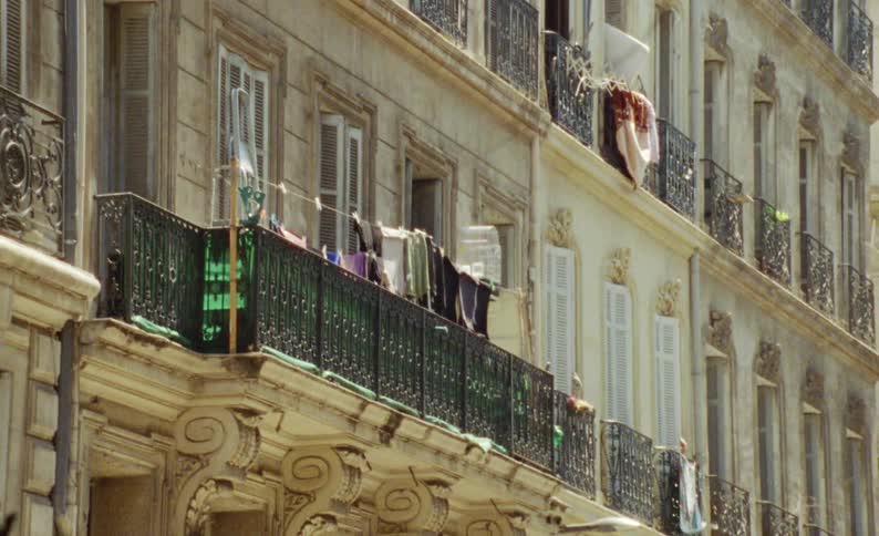 Residential buildings with balconies with clothes that dry in the sun