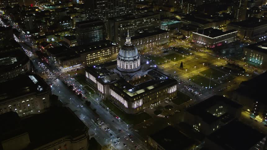 A large domed building in the center of a city