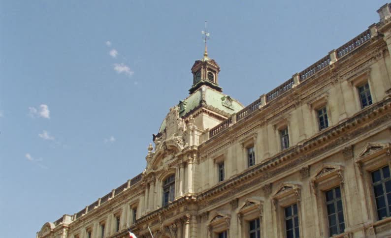 An old building with a flag flying in front of it