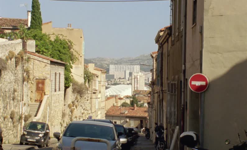 Cars line the road in the city