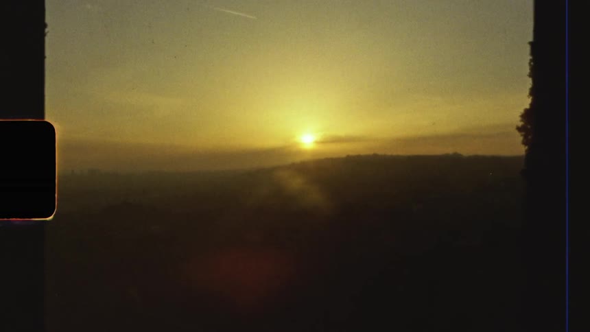 Sun sets over the hills caught on vintage film