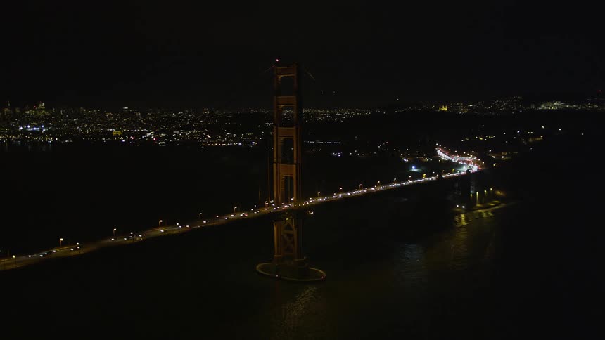 Large amounts of traffic driving over the golden gate bridge