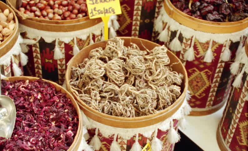 Rustic buckets with spices for sale in a store