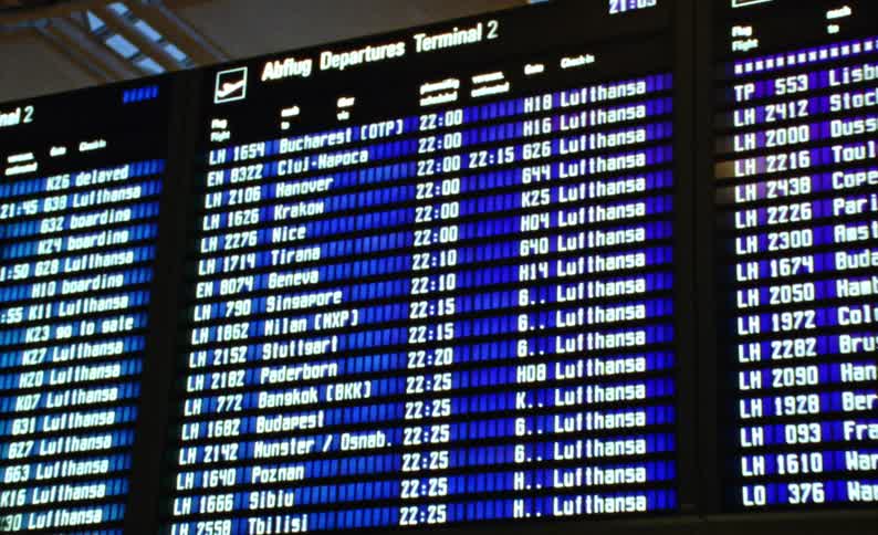 Digital panels with signage and flight and timetable information at an airport
