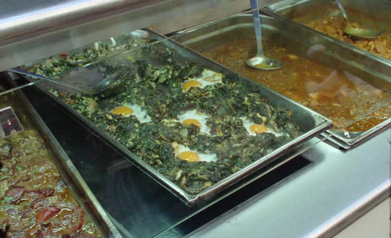 The trays are full of different meals