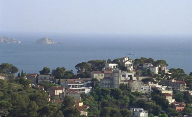 Panorama of houses built on hills by the sea