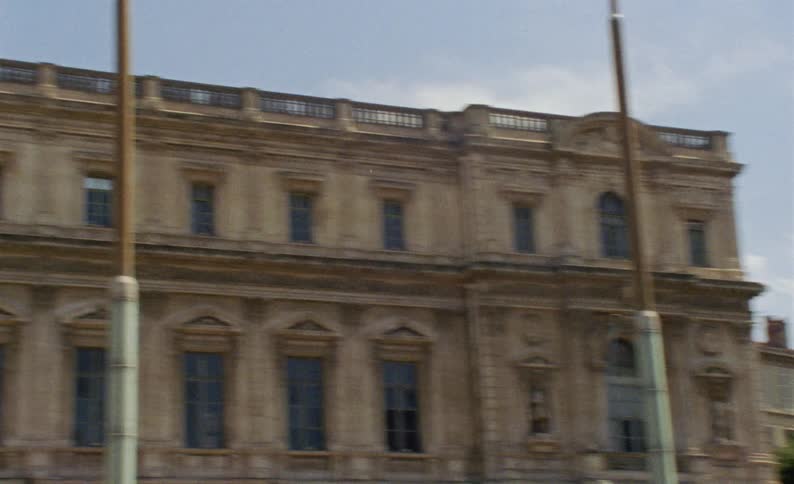 A flag is hanging on the side of the building