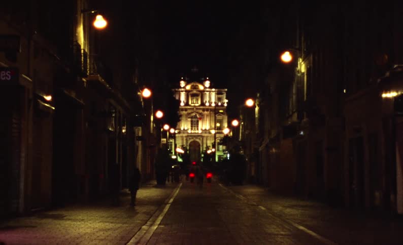A person walks down a city street