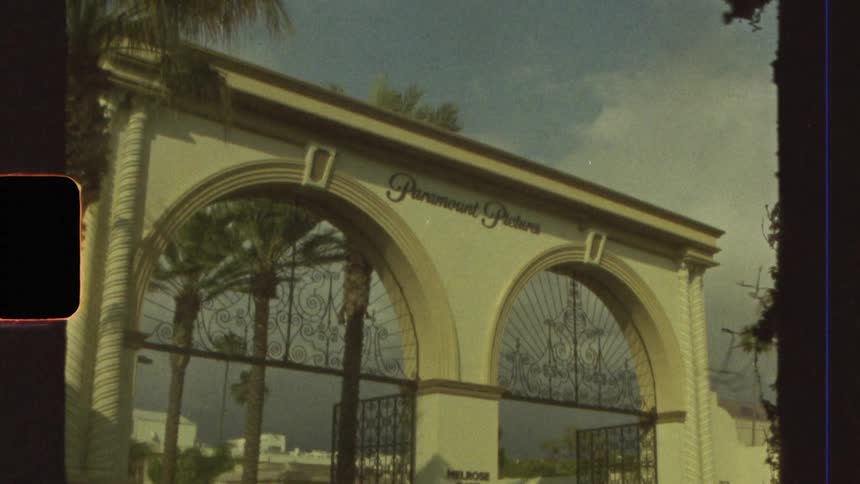 An archshaped gate with two entrances and writing in the middle