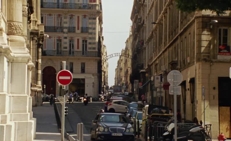 Street of an urban city with vehicle and pedestrian traffic