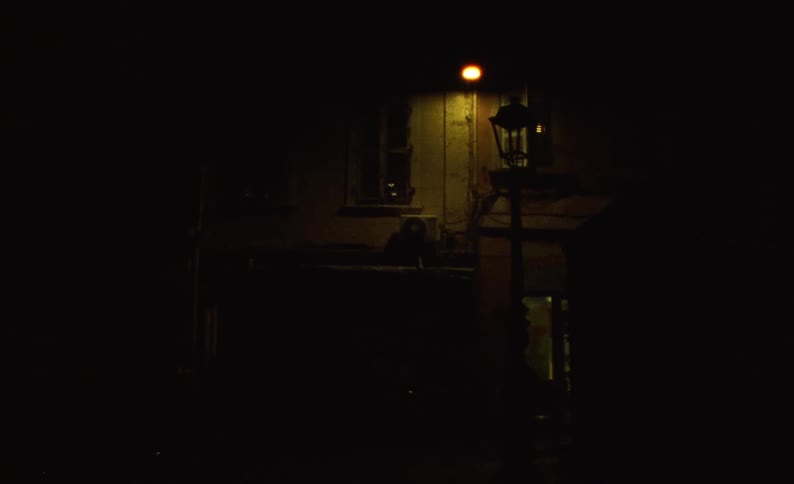 A dark city street at night