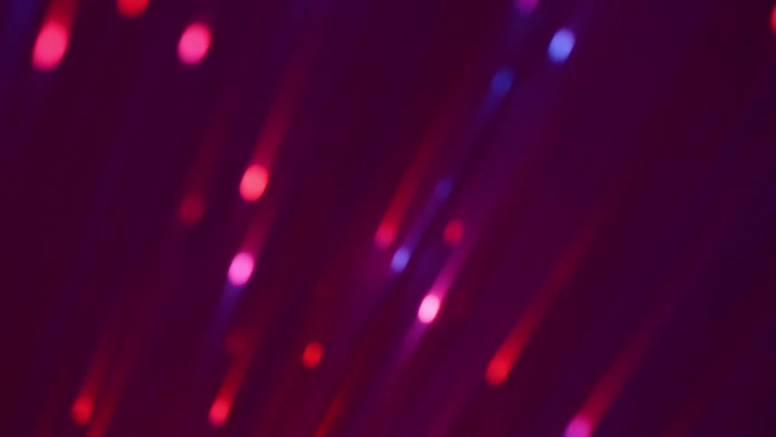 Closeup on bright threads of red and violet color and abstract background