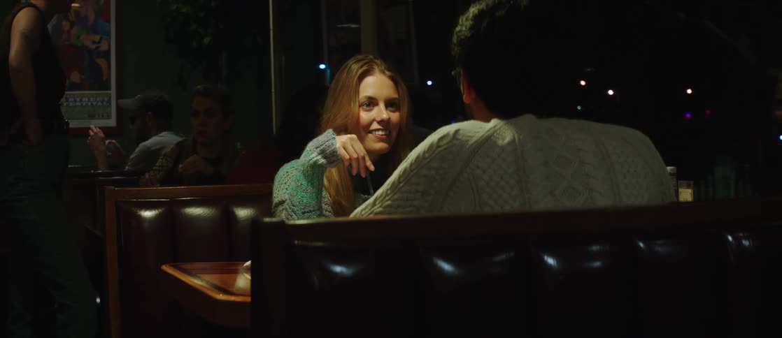 A young couple have a date in a cozy restaurant