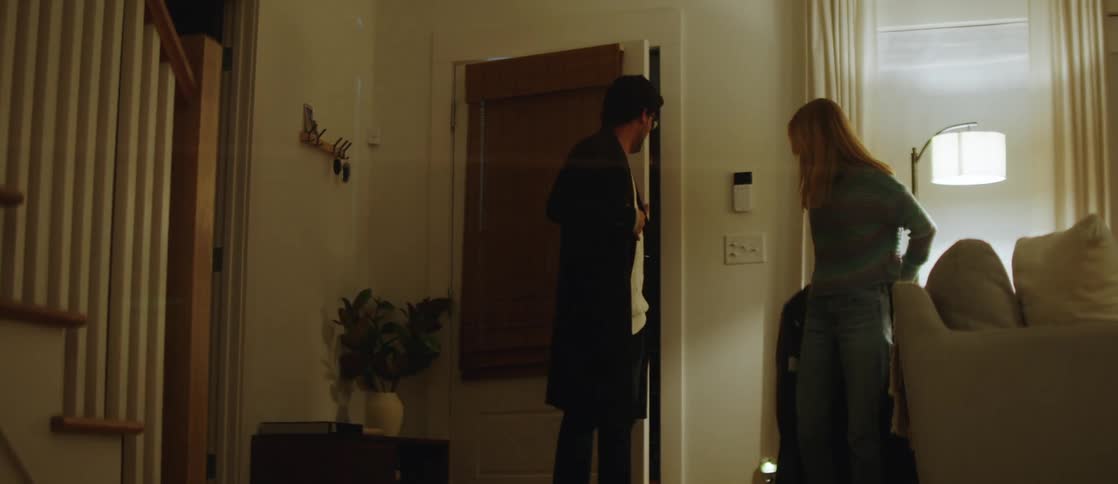 A man and a woman enter a home together