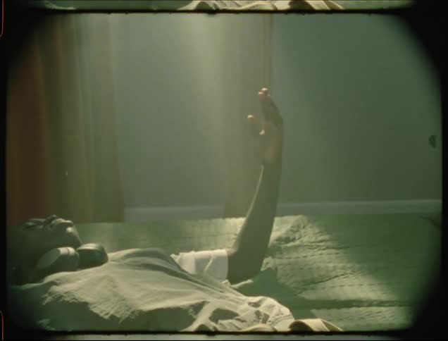 A clip of a person laying on the bed