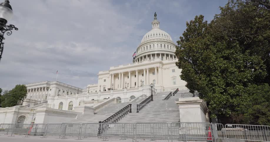 A fence blocks the steps leading to the capitol building