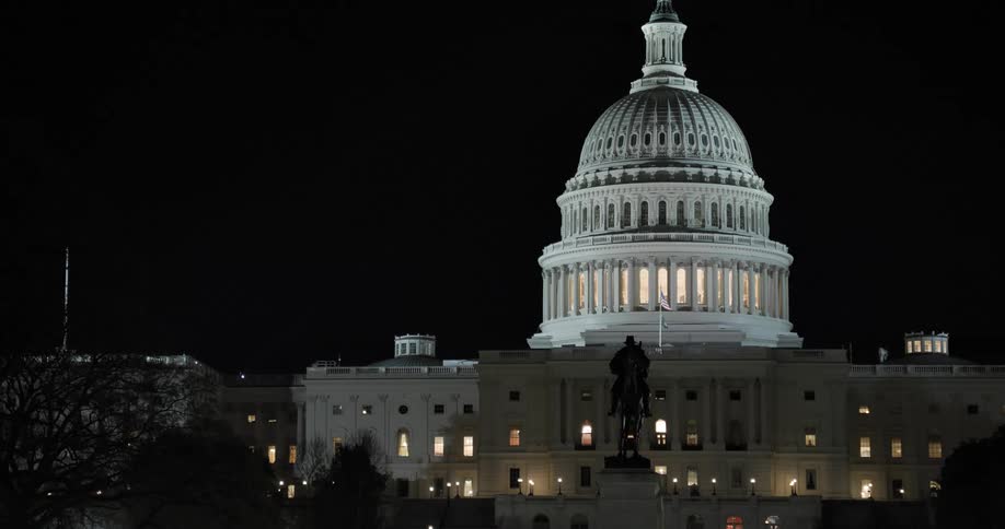 The lights are on in the capitol building at night