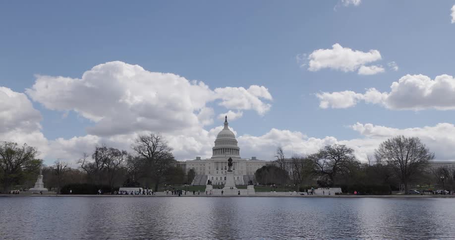 Visitors walk around the us capitol building
