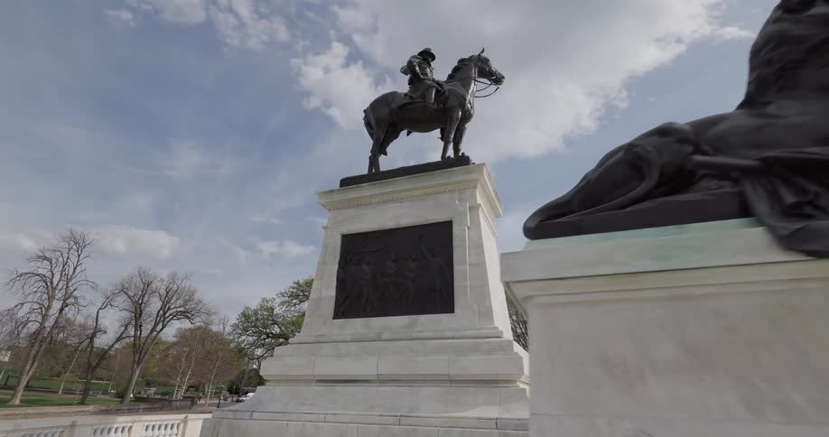 A monument of statues of lions and a man on a horse