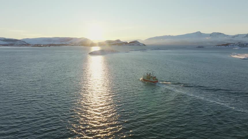 The boat is moving towards the shore