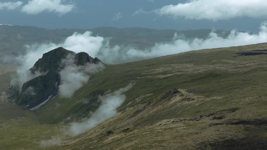A large mountain and lava fields near Peak of the Furnace volcano